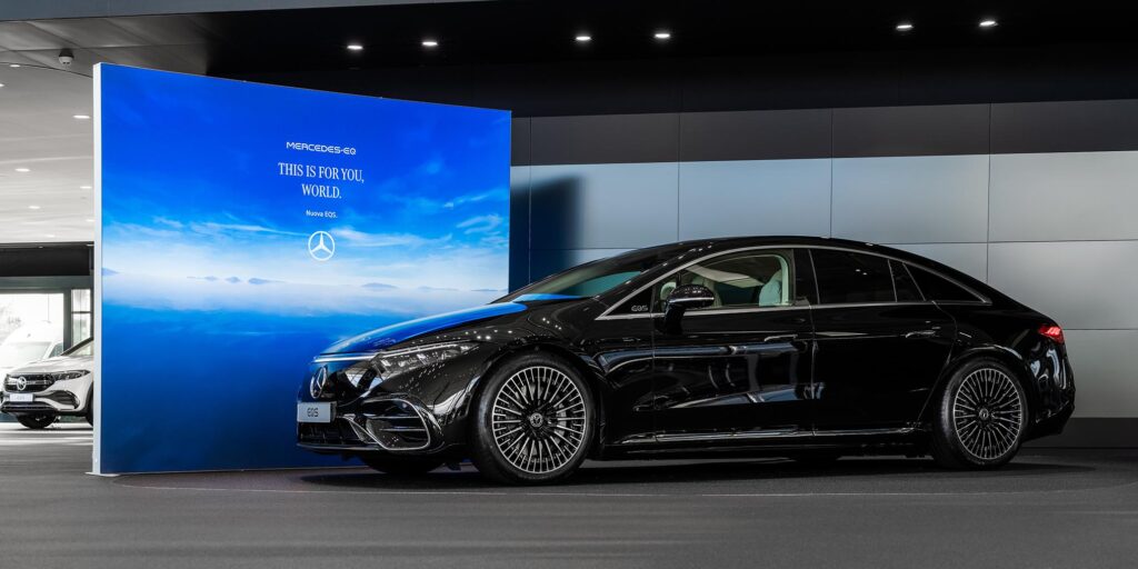 Large format SEG light box display showcasing luxury vehicle in modern showroom with backlit branded graphics