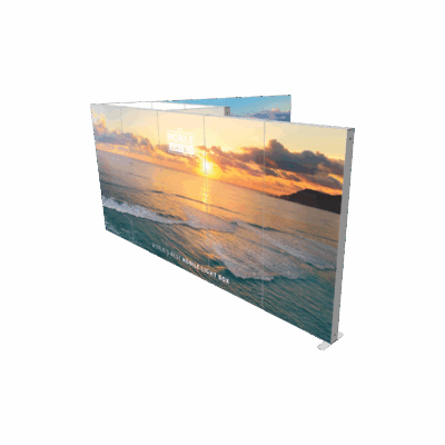 Modular SEG light box display with backlit sunset beach graphic showing portable trade show booth configuration
