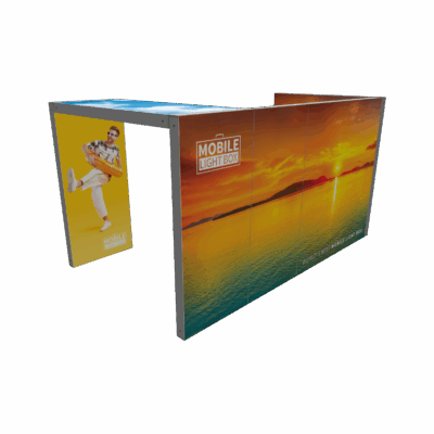 Mobile Light Box Kit G booth setup shown from the back-side angle with branded backlit SEG display walls.