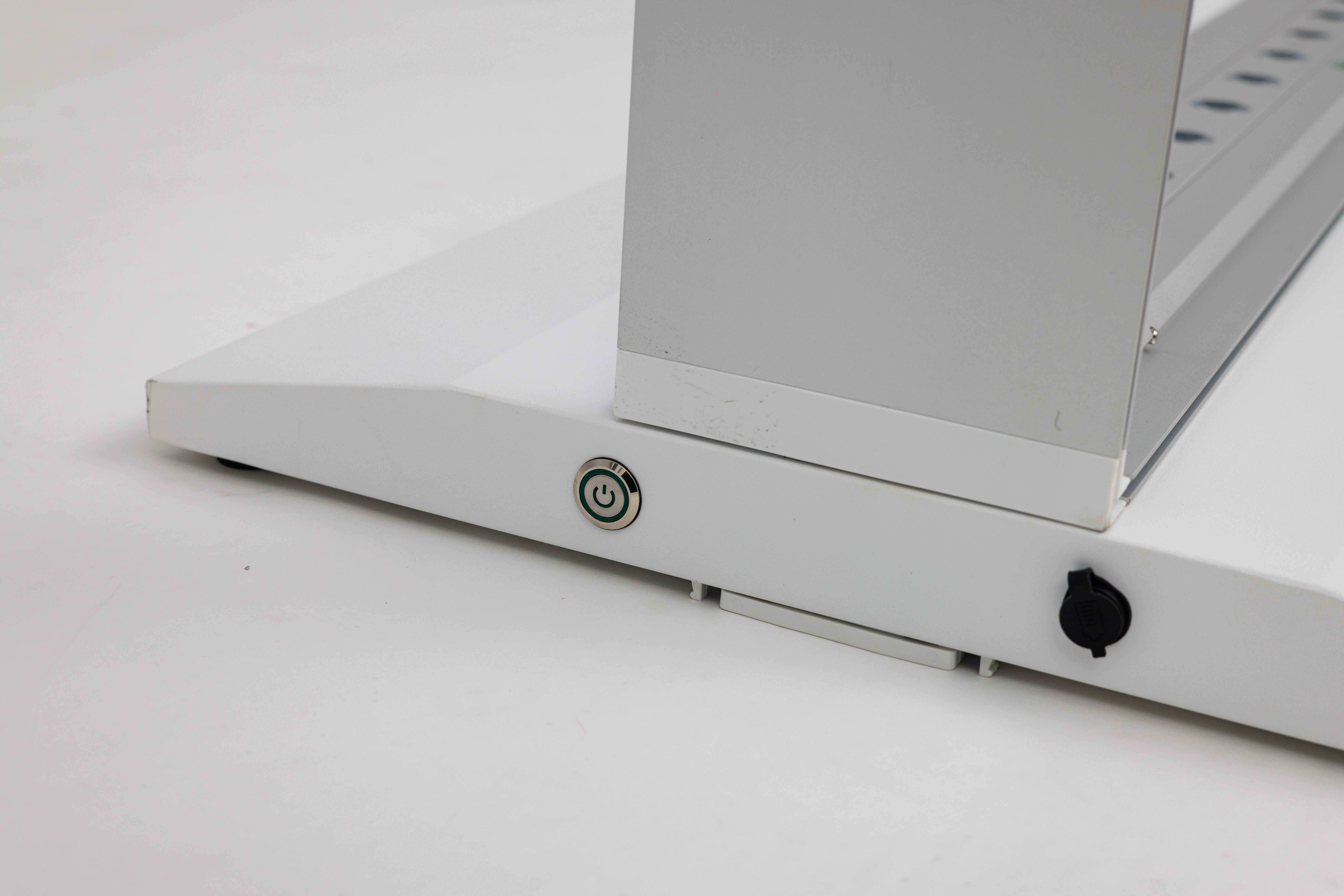 On/off switch and charge port detail on a Mobile Light Box battery base.