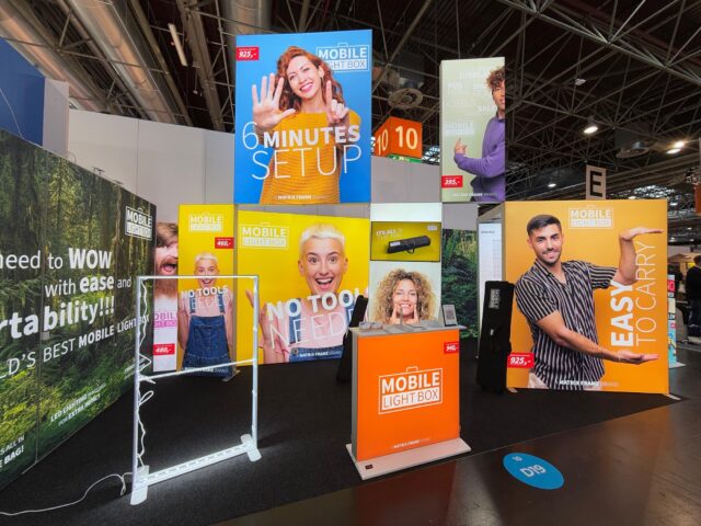Modular SEG light box trade show booth display with backlit banners and promotional graphics at exhibition