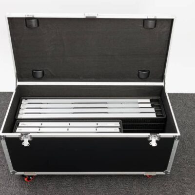 Portable trade show display road case with modular aluminum frames and LED light box components inside