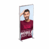 Portable SEG light box display with backlit fabric graphic showing promotional message at trade show