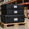 Mobile Light Box display frame cases neatly stacked on a pallet in a clean warehouse aisle, illustrating secure storage service at the Mobile Light Box Palm City facility.